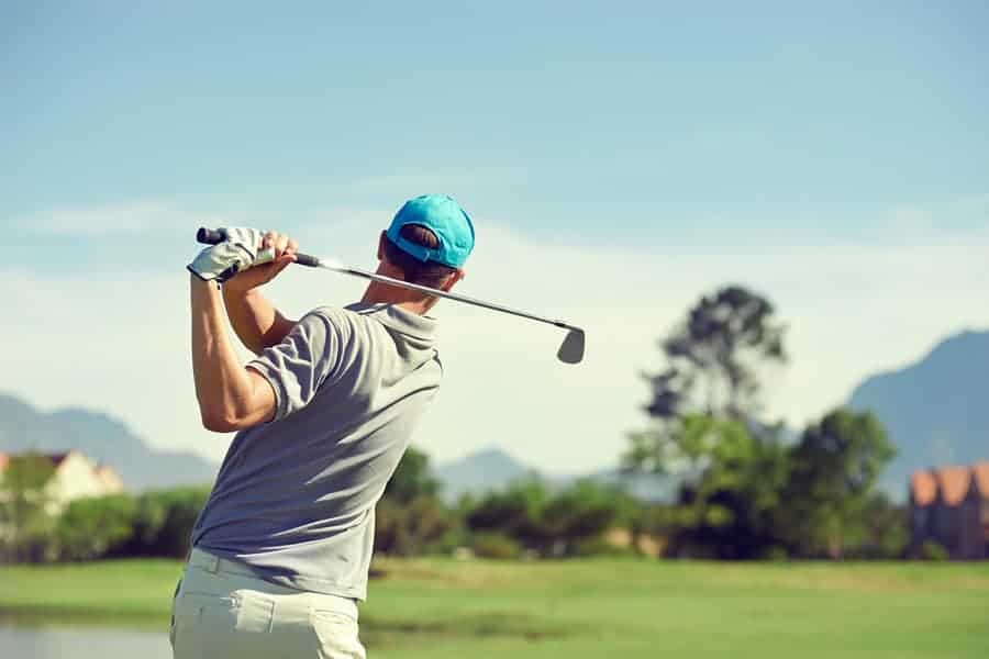 A golfer is seen hitting a shot over the golf course who has a 0.0 or better handicap recorded.
