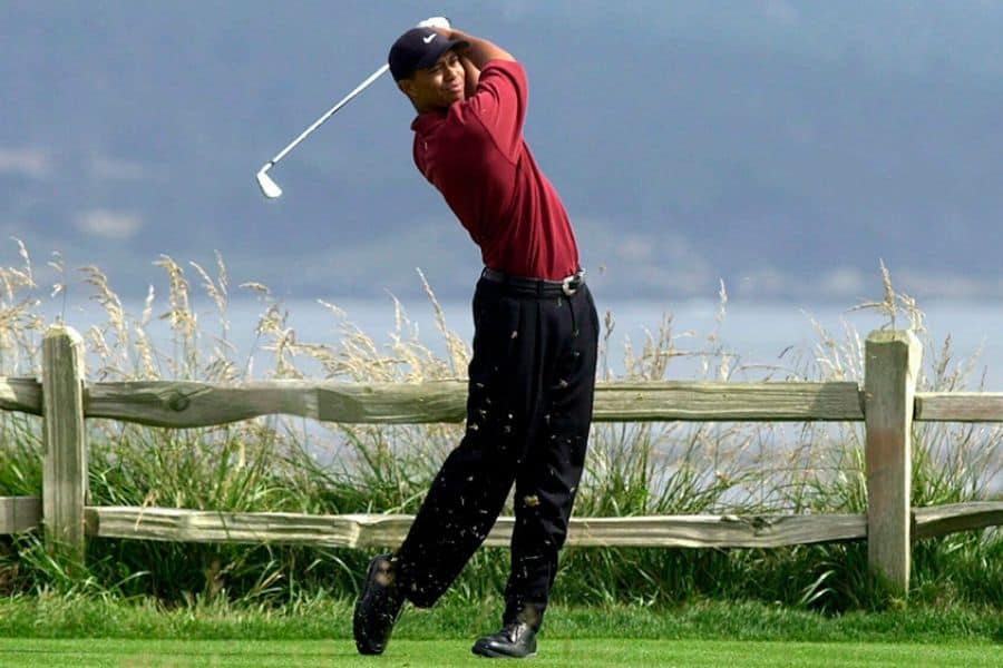 Tiger woods is playing his shot with the irons