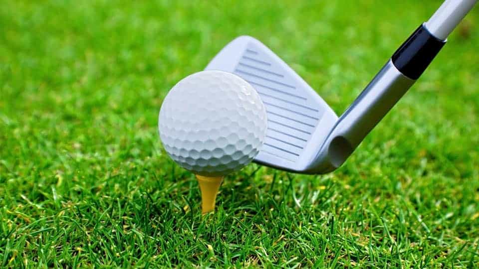 A wedge is used for hitting the golf ball placed on the tee of the course for an approach shot.