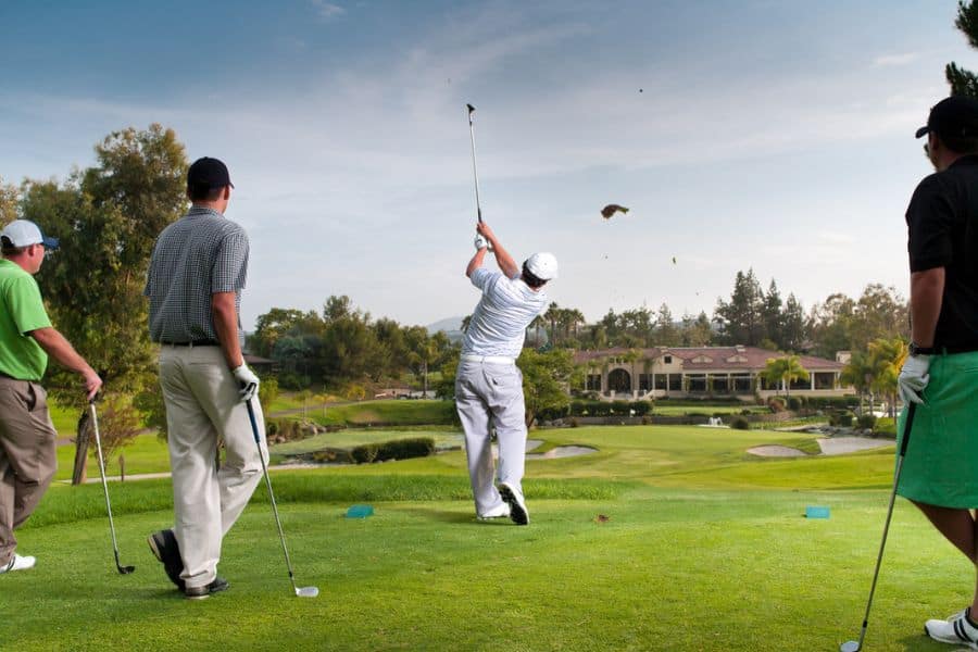 Golfers are playing golf on a golf course